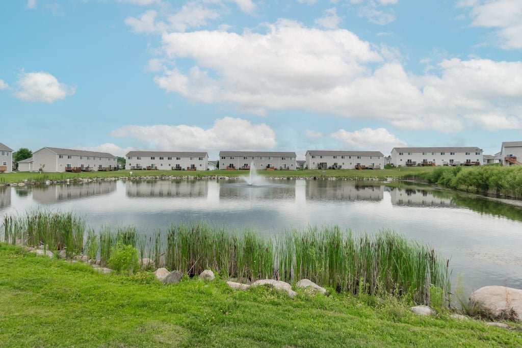 Check out this beautiful Greenhill Village condo with awesome views of the pond and a walk-out finished basement! This wonderful condo features an open main floor layout with a spacious kitchen, loads of cabinetry and new appliances. The open concept living area great for entertaining, featuring a corner fireplace and vaulted ceiling.